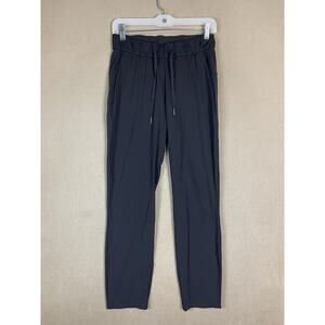 Lululemon On The Fly Pant Womens‎ 4 Black Elastic Waist Pocket Drawstring Logo